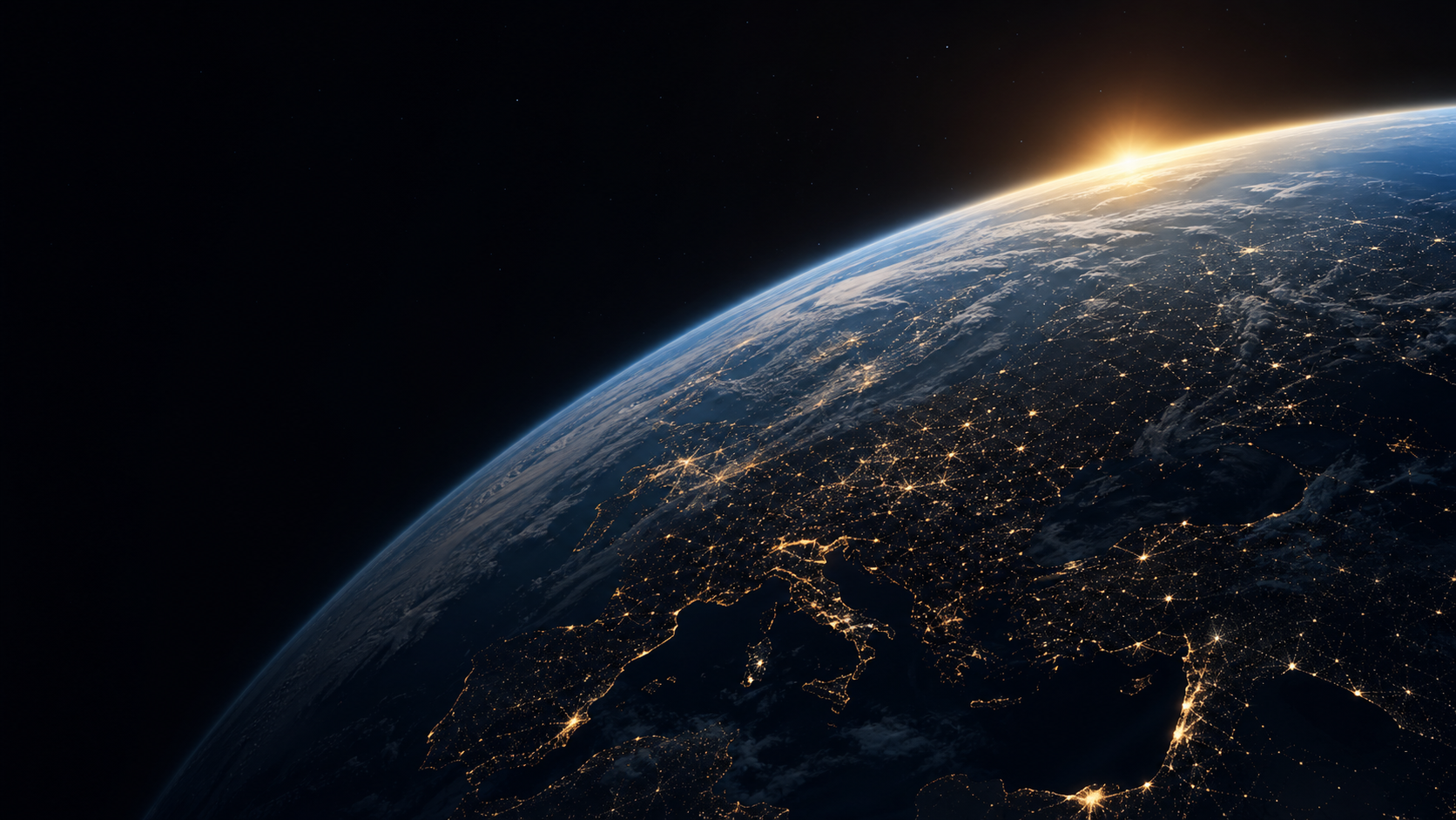 Earth viewed from space with sunrise and city lights